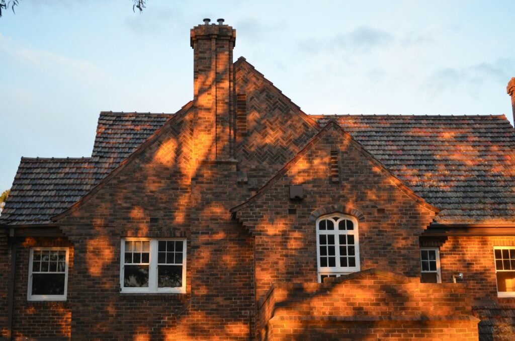 Brick house exterior under a clear blue sky