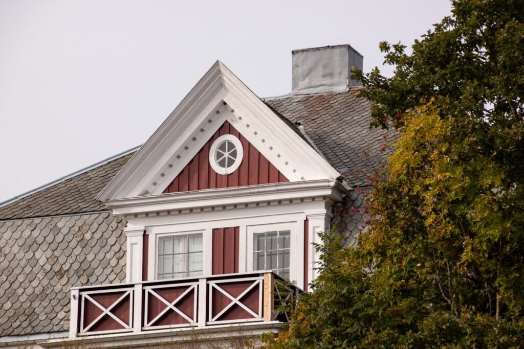 Residential house with a balcony, representative of the properties we maintain